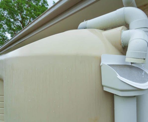 Rainwater running off roof into rainwater tank — NRW Consulting in Auckland, NZ