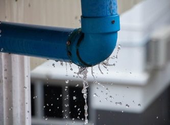 Blue Water Pipe With Leak — Water Management Near Me in Auckland, NZ