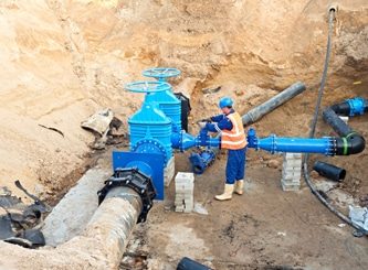 Workmen Installing Underground Pipes — Water Management Near Me in Christchurch, NZ