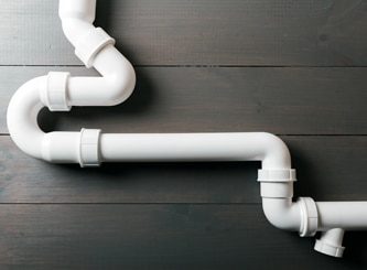 White Plastic Sewerage Water Pipes — Water Management Near Me in Auckland, NZ