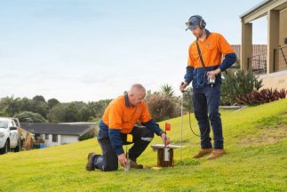 Two Workers Wearing Safety Gear Onsite — Water Management in Auckland, NZ