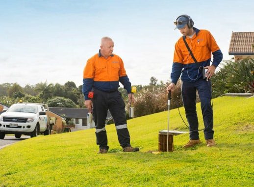 Two Workers Working in the Field while Detecting the Water Leak — Water Management in Auckland, NZ